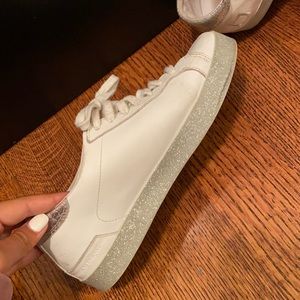 Platform white sneakers with a sparkly bottom